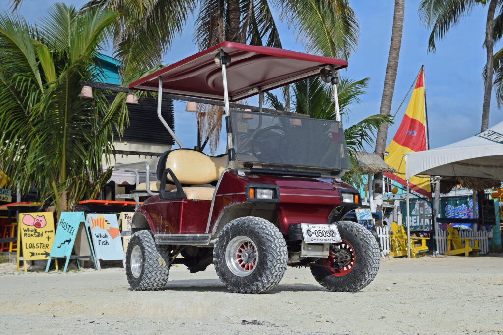 Club Car low speed vehicle on the beach island ev
